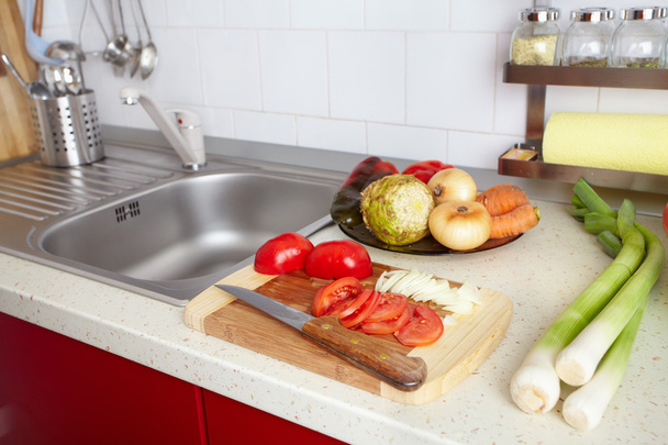 Kitchen interior with fresh vegetables - Фото, изображение