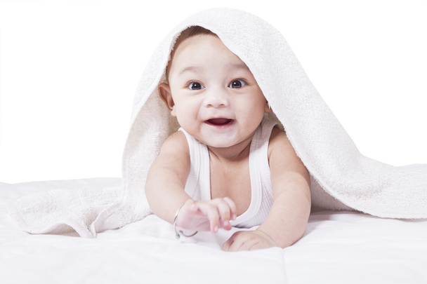 Adorable baby crawling on bed - Foto, imagen