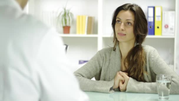 Smiling Young Woman Taking Prescription from Doctor - Filmmaterial, Video