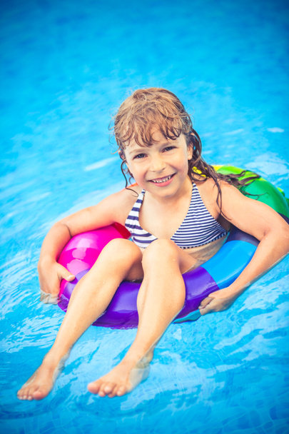 Child playing in swimming pool - Fotó, kép