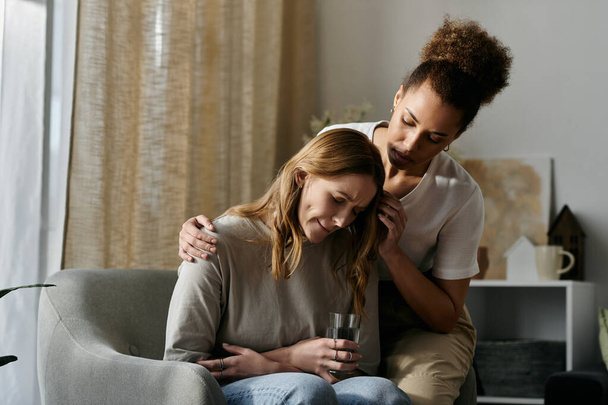 A lesbian couple finds solace in each others presence at home. - Photo, Image