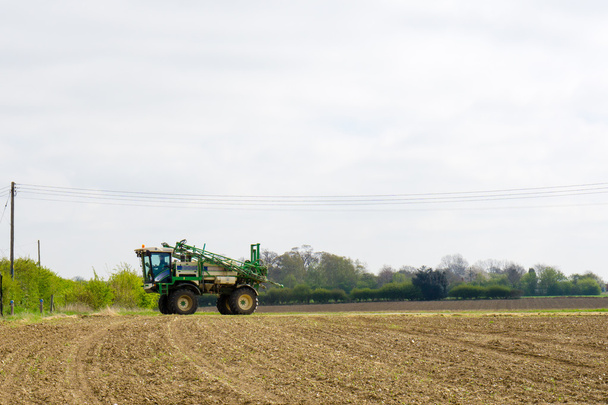 Farmer Ploughing field in rural Suffolk, England - Photo, Image