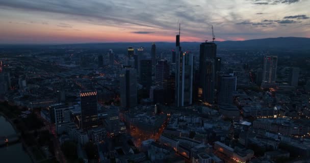 Frankfurt am Main, Hessen, Germany, May 9th, 2024: Frankfurt am Main skyline, office buildings at night. Aerial view. - Footage, Video
