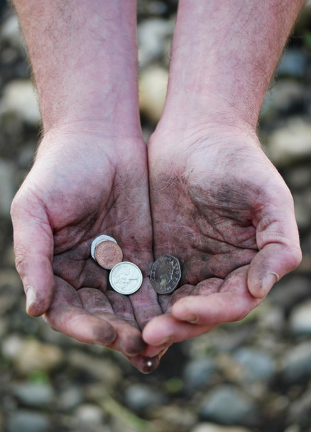 Dirty cupped hands holding few coins - Photo, Image