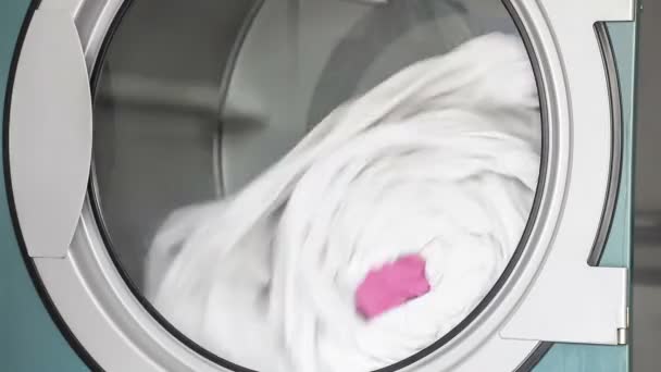 Large washing machine transparent glass door, Doing the laundry with item of towel. - Footage, Video
