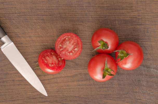 Juicy Cherry tomatoes on wooden background closeup - Zdjęcie, obraz
