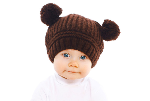 Closeup portrait of cute baby in brown hat - Zdjęcie, obraz