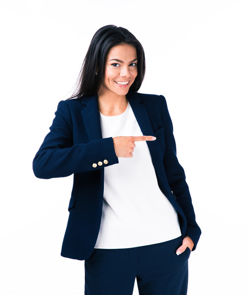 Cheerful young businesswoman pointing finger away - Zdjęcie, obraz