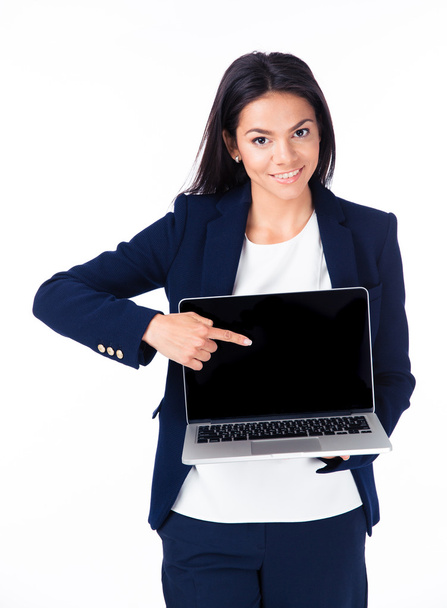 Smiling businesswoman pointing on the blank laptop screen - Zdjęcie, obraz