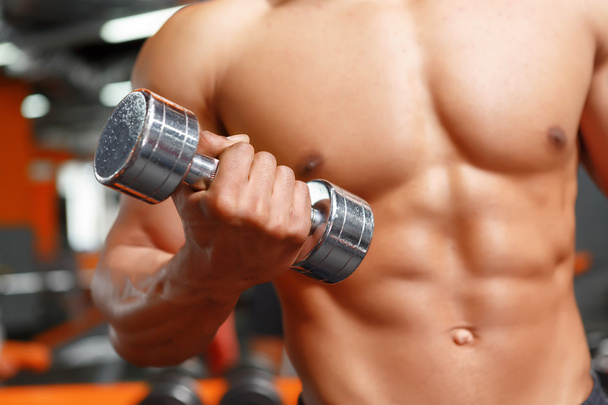 Power lifter working out with dumbbells in gym - Foto, Imagen