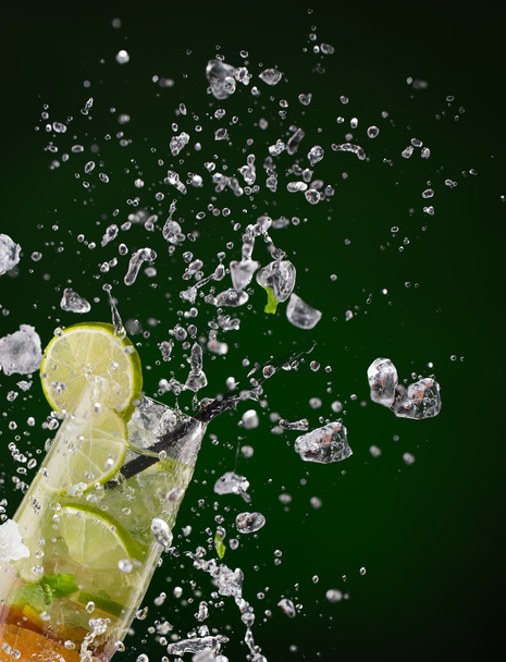Fresh mojito drink with ice cubes and splashes - Zdjęcie, obraz