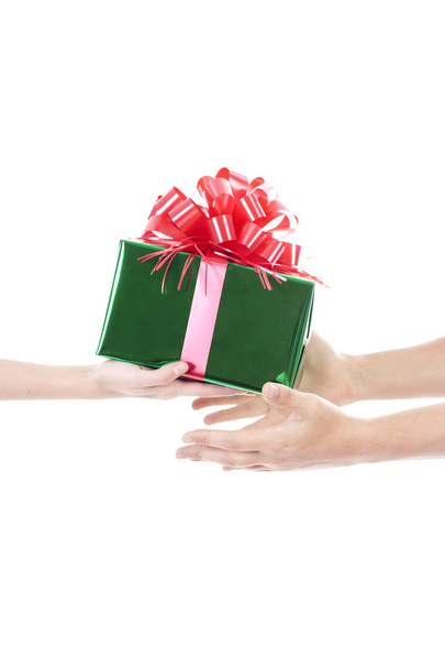 Hands giving and receiving a present - Foto, imagen