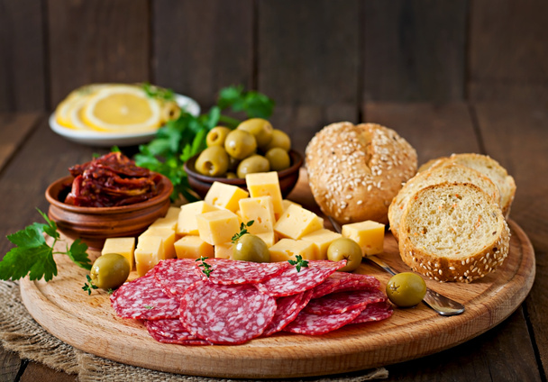 Antipasto catering platter with salami and cheese - Фото, изображение