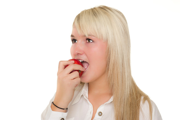 Young girl eating an apple - Фото, зображення