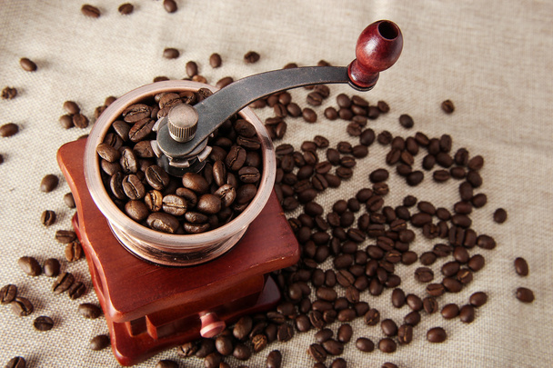 Coffee bean and coffee bean grinder - Fotó, kép