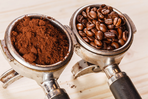 Grounded coffee and beans in handle - Photo, Image