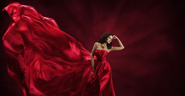 Red Dress, Woman in Flying Fashion Silk Fabric Clothes, Model Posing Waving Cloth - Foto, immagini