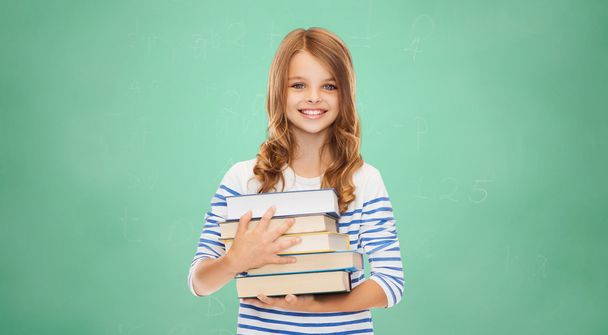 happy little student girl with many books - Fotoğraf, Görsel