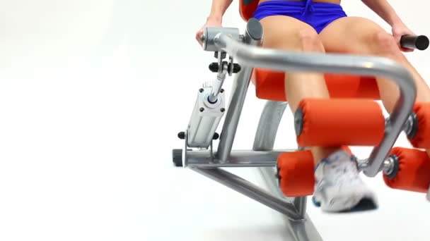 Closeup of woman on hydraulic exerciser - Video