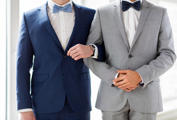 close up of happy male gay couple holding hands - Fotoğraf, Görsel