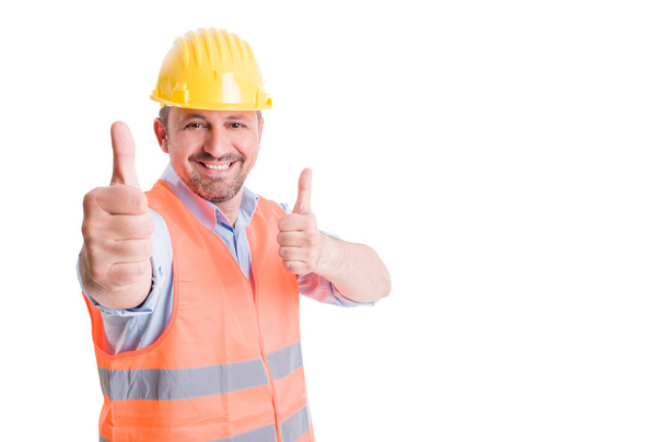 Happy constructor smiling and showing thumbs up - Foto, Bild