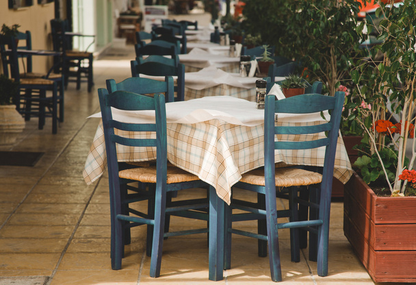 Blue chairs on a greek cafe - Fotoğraf, Görsel