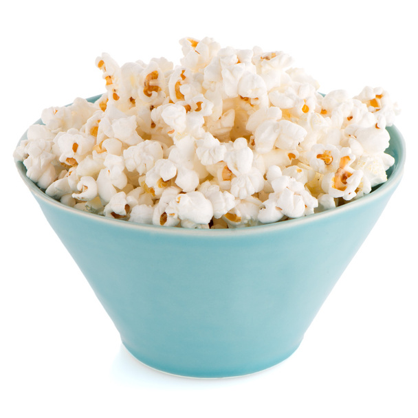 Popcorn in a blue bowl - Фото, зображення