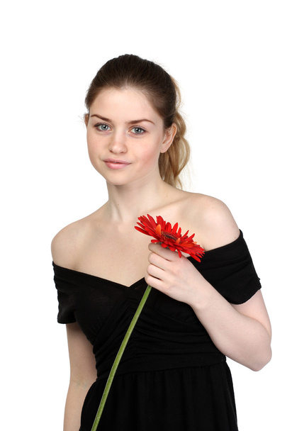 Beautiful girl with flower in black dress - Foto, immagini