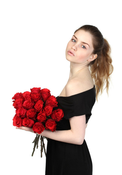 Beautiful brunette with a bouquet of roses - Foto, afbeelding
