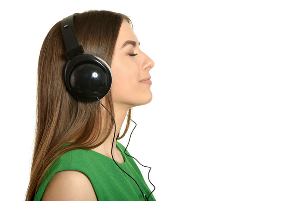 Girl listening to music in headphones - Фото, зображення