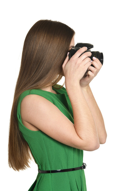 Young woman with camera - 写真・画像