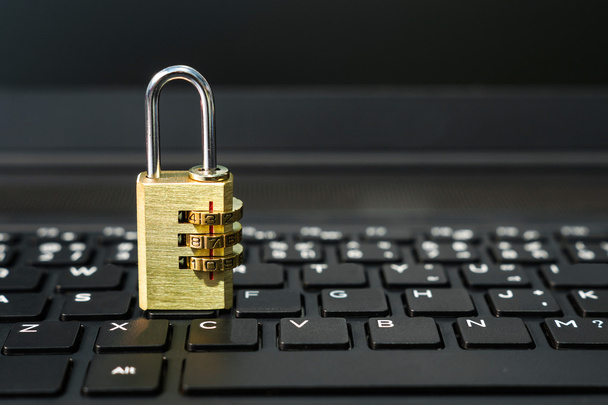 Security lock on black keyboard - Foto, Imagen