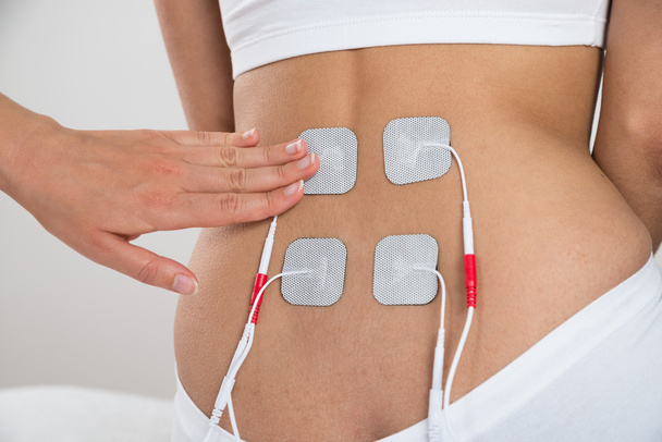 Therapist Placing Electrodes - Zdjęcie, obraz