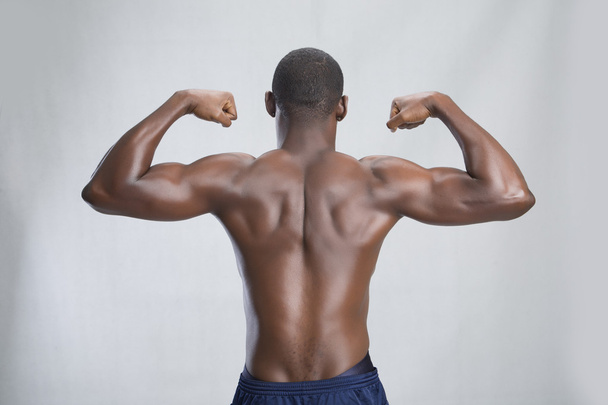 Young sportsman shows his back - Photo, Image