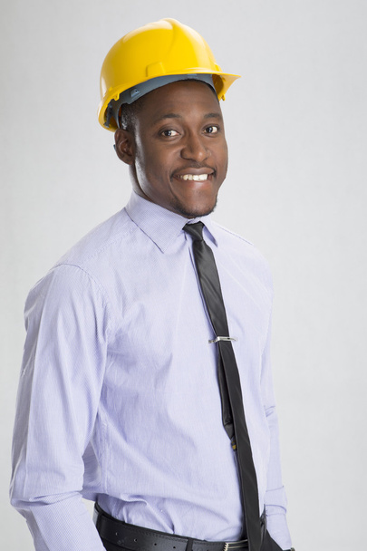 Young smiling engineer with helmet - Zdjęcie, obraz