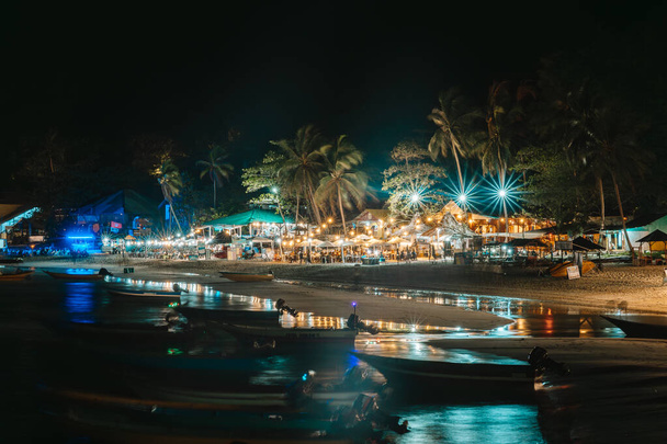 Night View of Long Beach with Ocean Waves, Tourists, Resorts in Perhentian Islands - Photo, Image