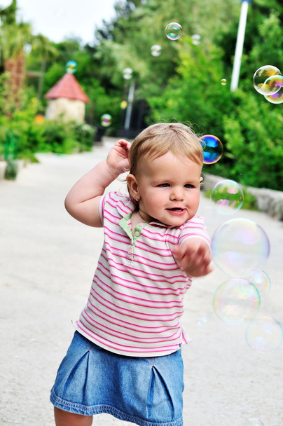 Baby girl catching soap bubbles - Фото, зображення