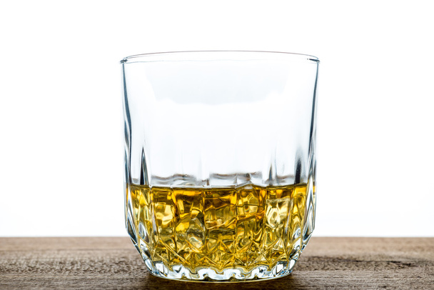 Whiskey glass with ice cubes on wooden - Φωτογραφία, εικόνα