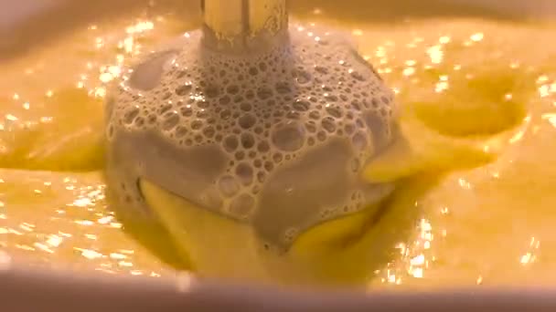 Whipping the cream with a mixer. Automatic flour mixing machine mixing cream cake. - Footage, Video