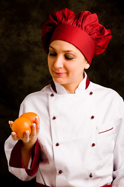 Chef is controlling orange quality - Foto, Bild