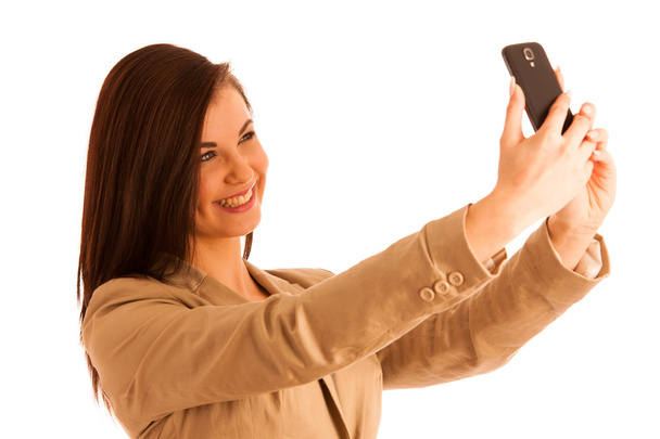 Beautiful woman taking a selfie with smartphone on white backgro - Φωτογραφία, εικόνα