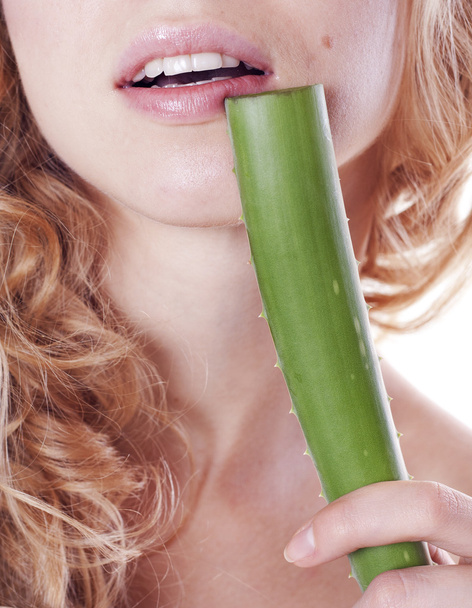 Young woman’s lips with aloe - Foto, imagen
