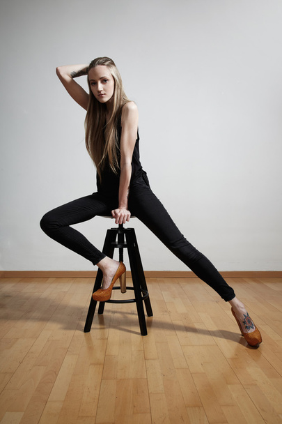 Model posing on chair - Photo, image