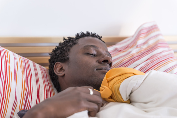 Peaceful african american man sleeping - Foto, afbeelding