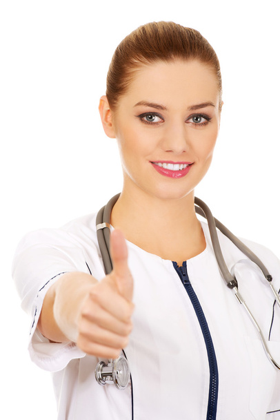Medical doctor woman with thumbs up. - Zdjęcie, obraz