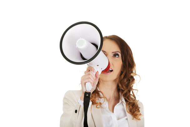 Businesswoman shouting with megaphone. - Photo, image