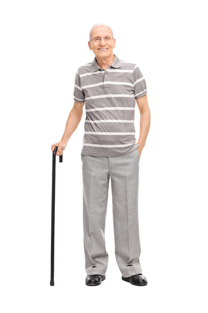 Old man holding a cane - Фото, зображення