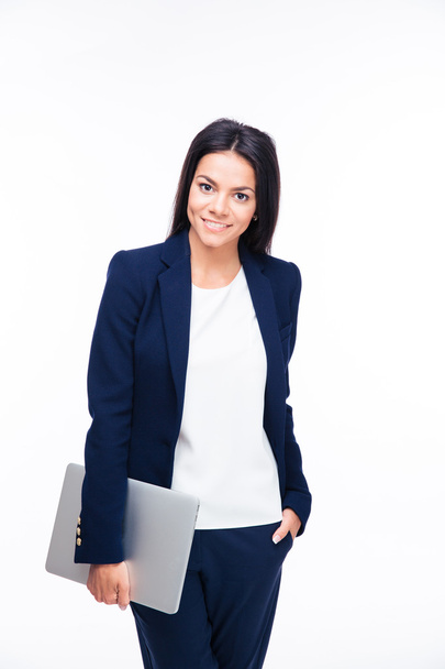 Happy businesswoman standing with laptop - Photo, image