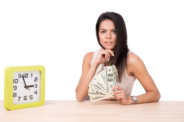 Happy businesswoman sitting at the table with money - Foto, Imagen