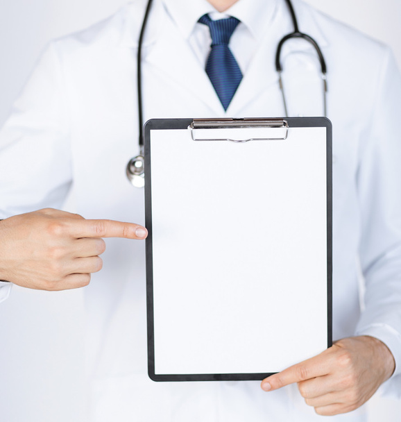 doctor pointing at blank white paper - Photo, image